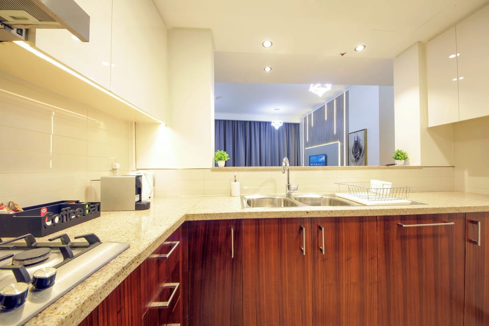 Deluxe Apartment, Balcony, City View | Private kitchen | Coffee/tea maker, electric kettle