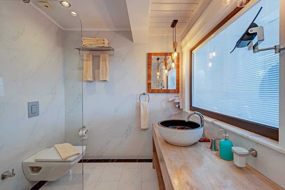 Honeymoon Double Room, Balcony, Sea View | Bathroom | Free toiletries, hair dryer, bathrobes, slippers