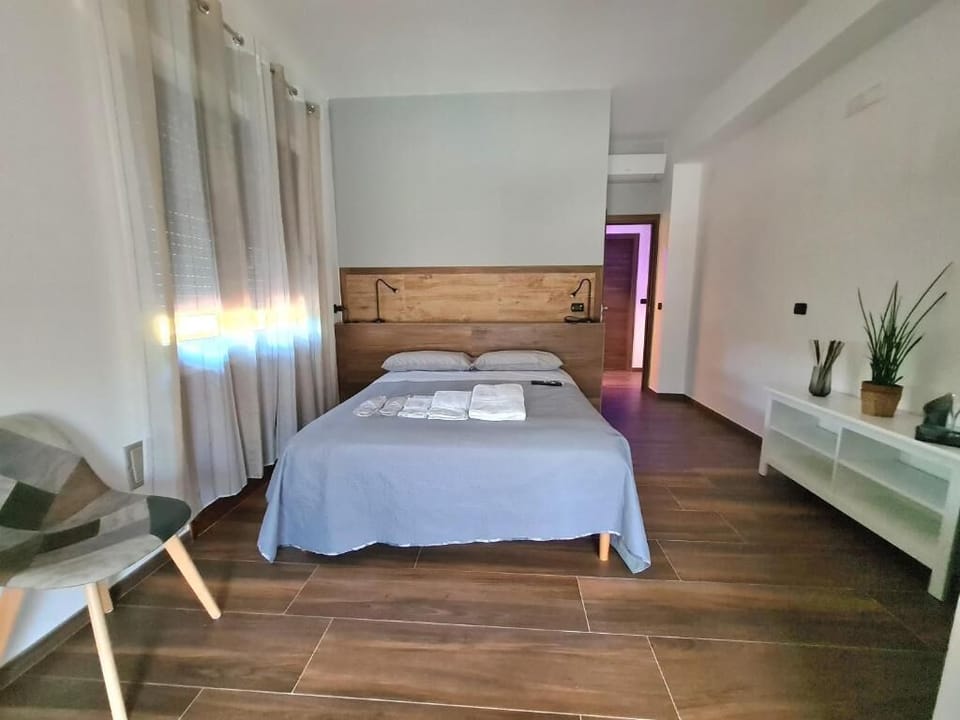 Deluxe Quadruple Room, Mountain View | Premium bedding, down comforters, memory foam beds, minibar