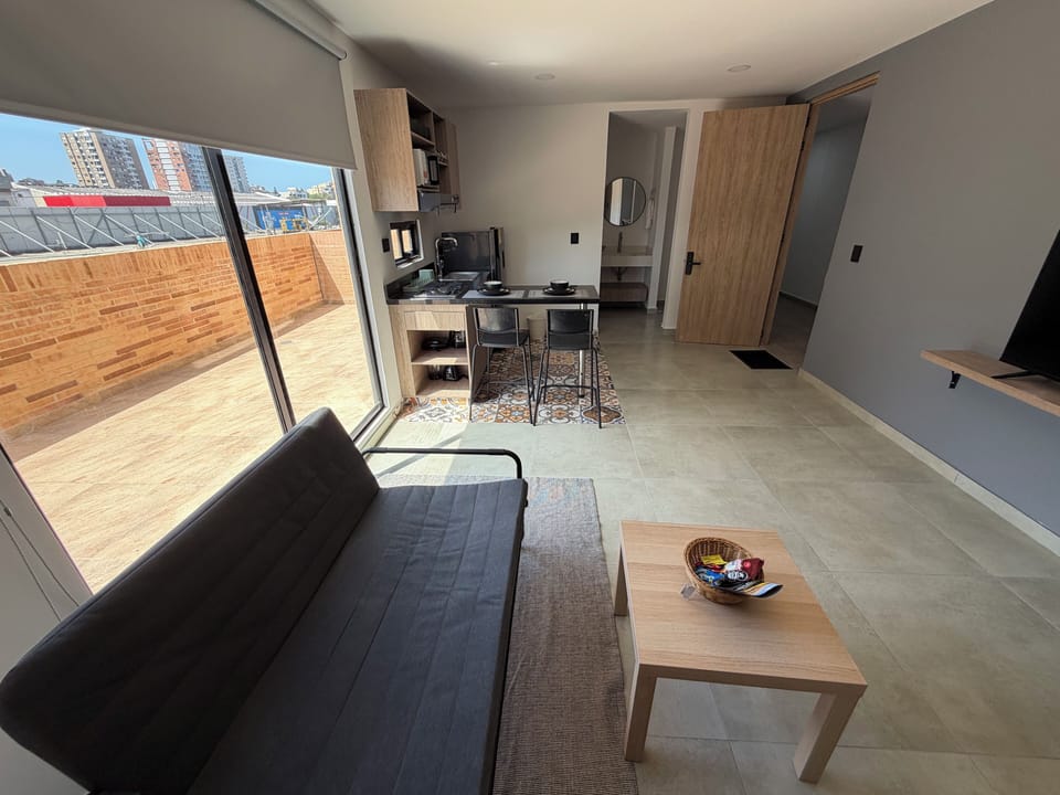 Deluxe Studio, City View | Living area | 32-inch Smart TV with digital channels