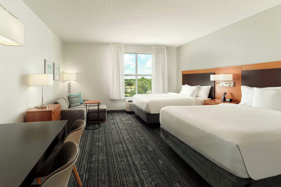 Premium bedding, desk, laptop workspace, soundproofing