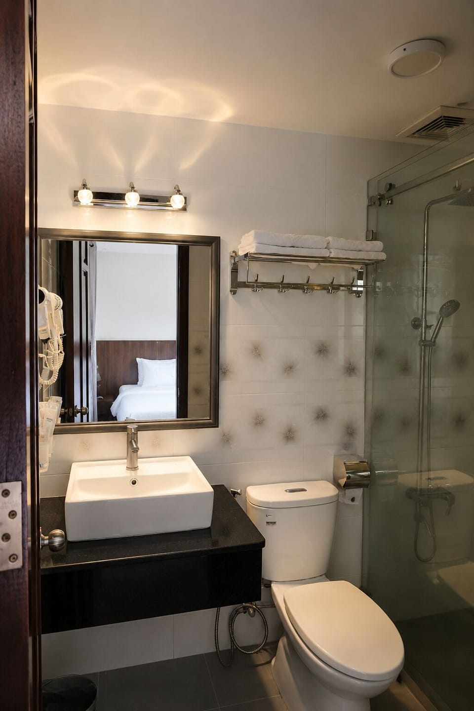 Shower, hair dryer, slippers, towels