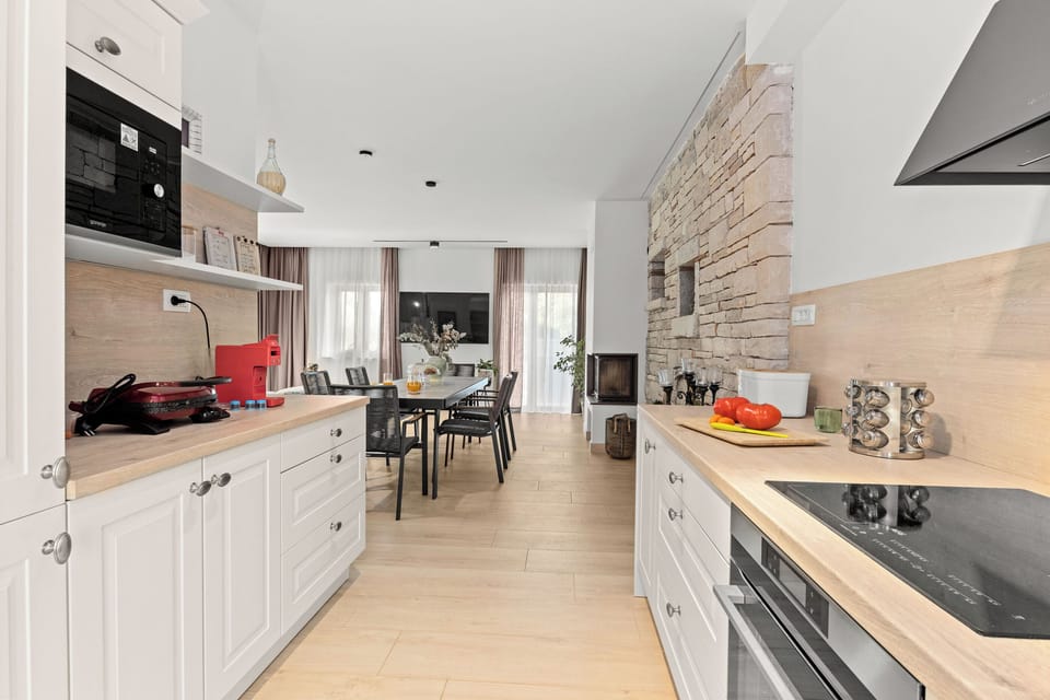 Villa | Private kitchen | Fridge, microwave, oven, stovetop
