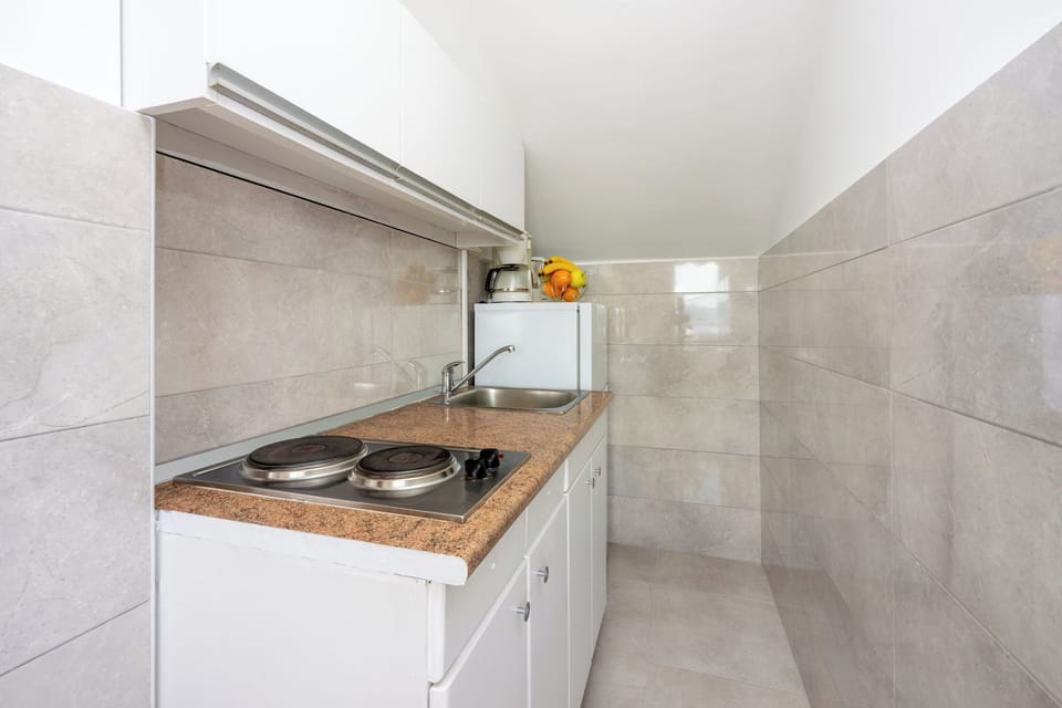 Apartment (A4) | Private kitchen | Fridge, stovetop, espresso maker, electric kettle