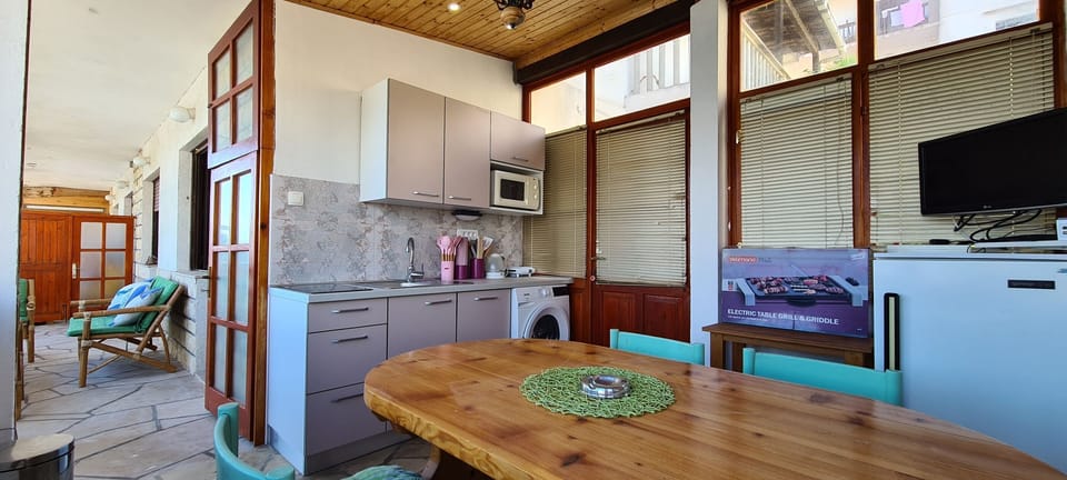 Apartment (A1) | Private kitchen | Fridge, microwave, stovetop, dishwasher