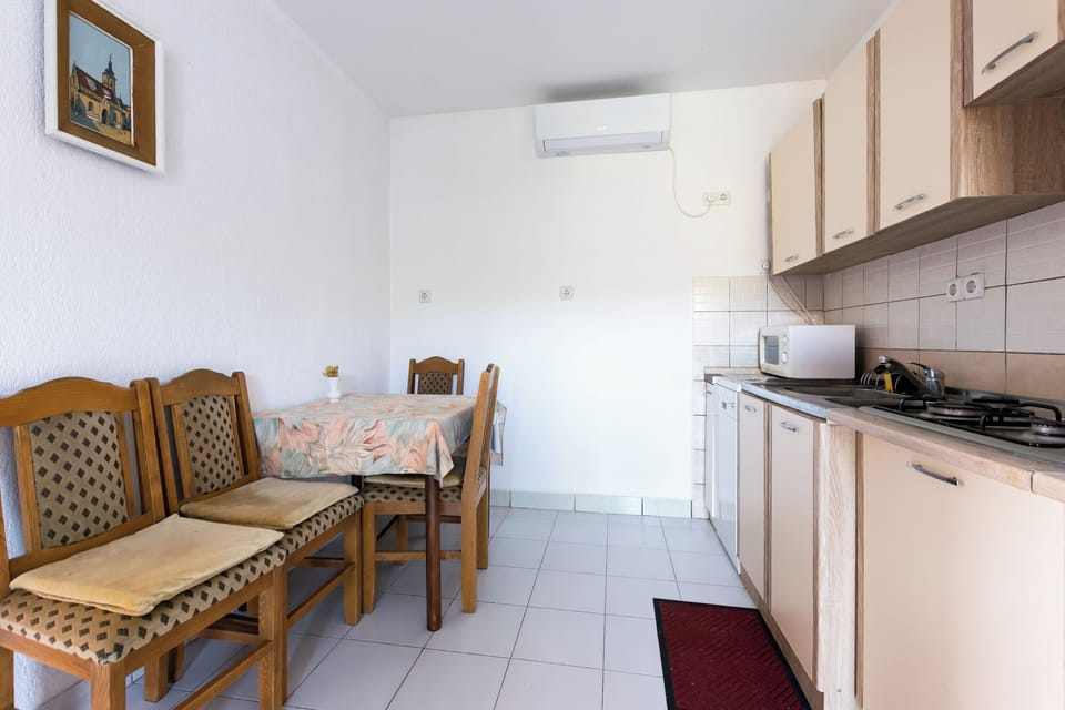Apartment (A1) | Private kitchen | Fridge, microwave, stovetop, dishwasher