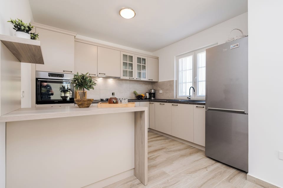 Villa | Private kitchen | Fridge, microwave, oven, stovetop