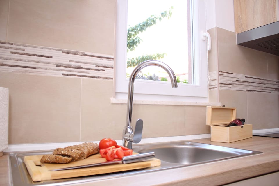 Villa | Private kitchen | Fridge, oven, stovetop, dishwasher
