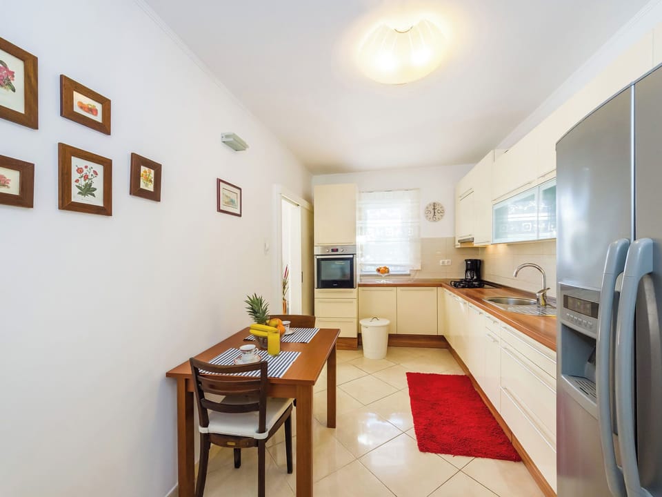 Villa | Private kitchen | Fridge, microwave, oven, stovetop