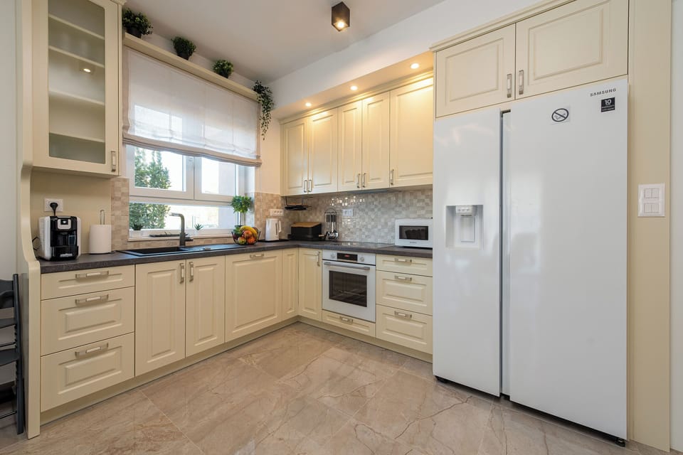 Villa | Private kitchen | Fridge, microwave, oven, stovetop