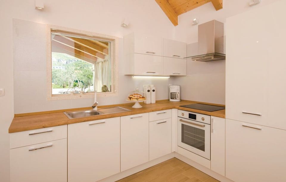 Villa | Private kitchen | Fridge, microwave, oven, stovetop