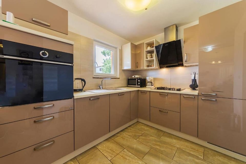 Villa | Private kitchen | Fridge, microwave, oven, stovetop