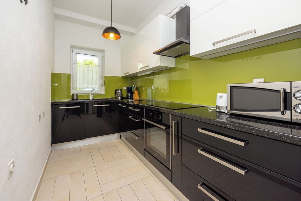 Villa | Private kitchen | Fridge, microwave, oven, stovetop