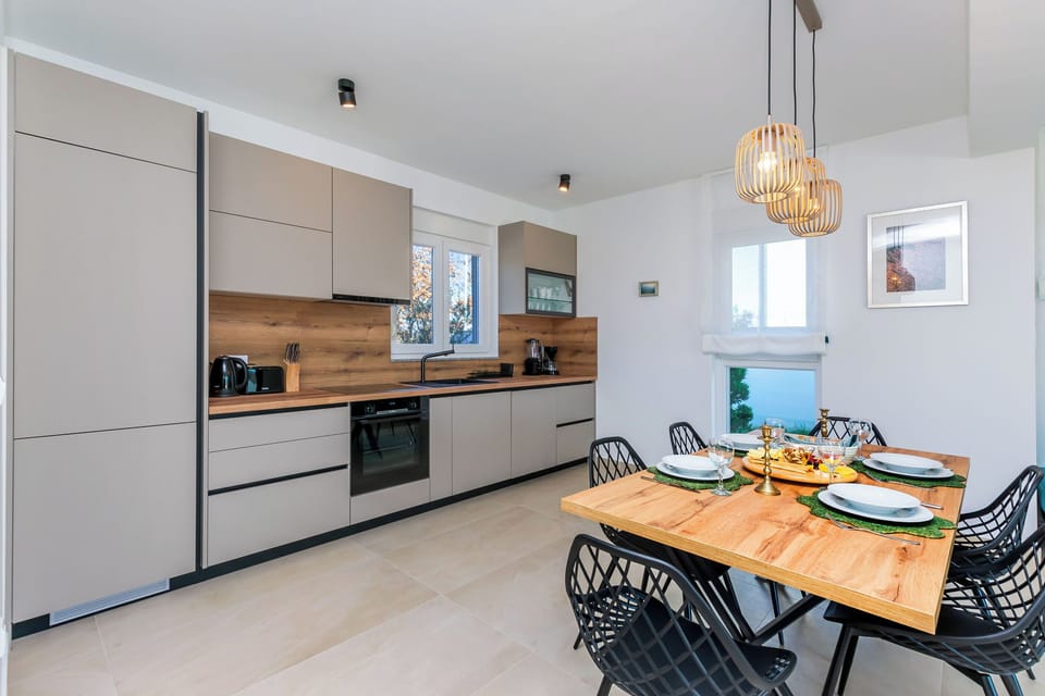 Villa | Private kitchen | Fridge, oven, stovetop, dishwasher