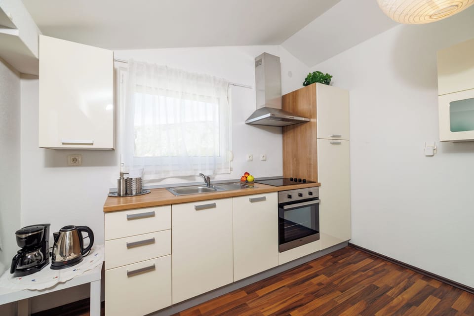 Villa | Private kitchen | Fridge, microwave, oven, stovetop
