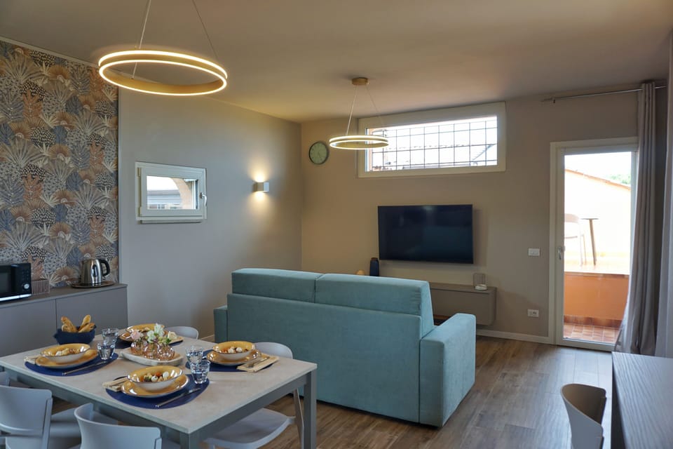 Deluxe Apartment, Lake View | Living area | 50-inch flat-screen TV with digital channels, heated floors