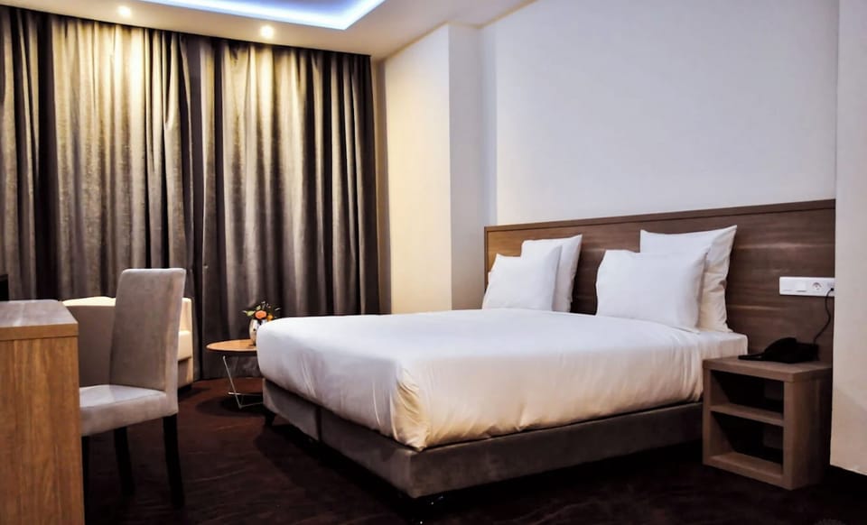 Standard Double or Twin Room | In-room safe, desk, laptop workspace, blackout drapes