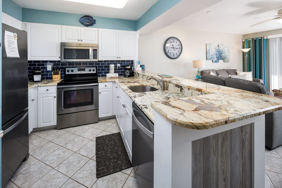 Condo (Pelican Isle 306 - Waves of Bliss) | Private kitchen | Cookware/dishes/utensils