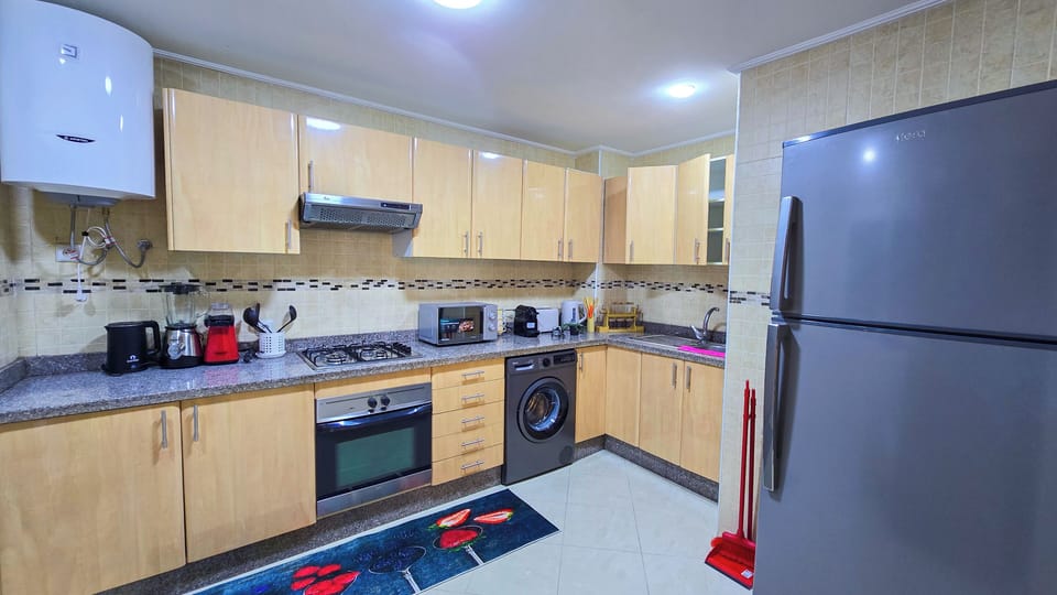 Premium Apartment, 2 Bedrooms, Beachfront | Private kitchen | Microwave, oven, stovetop, highchair