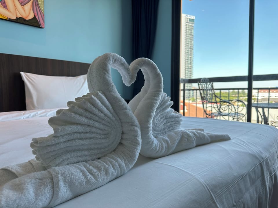 Superior Studio Suite, City View | Free minibar, desk, laptop workspace, bed sheets