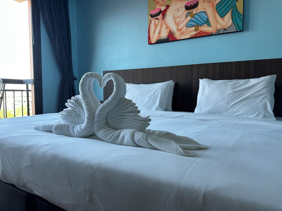Superior Studio Suite, City View | Free minibar, desk, laptop workspace, bed sheets