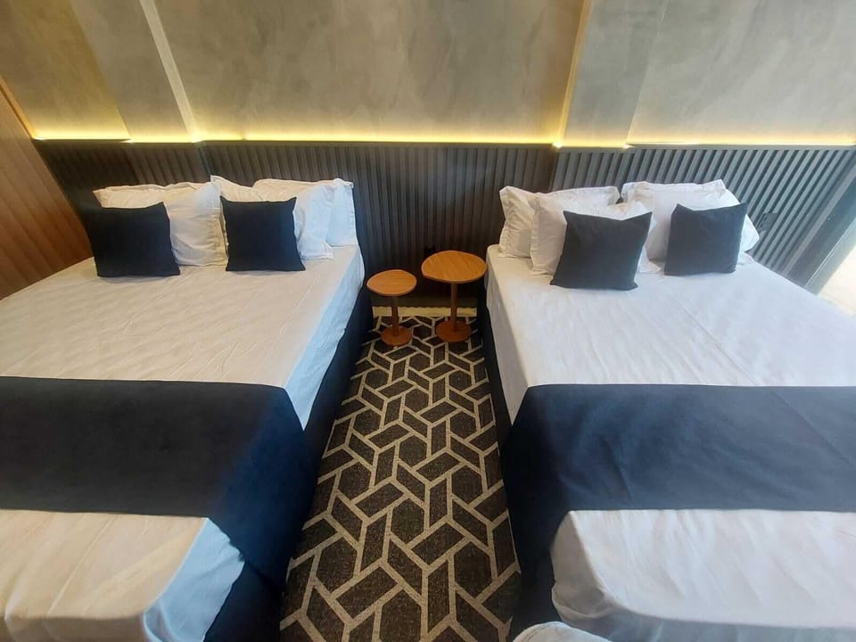 Deluxe Quadruple Room, Sea View | In-room safe, desk, laptop workspace, WiFi (free)
