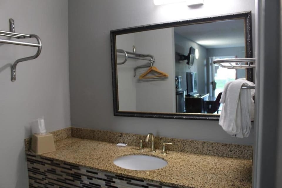 Bathtub, towels, soap, toilet paper