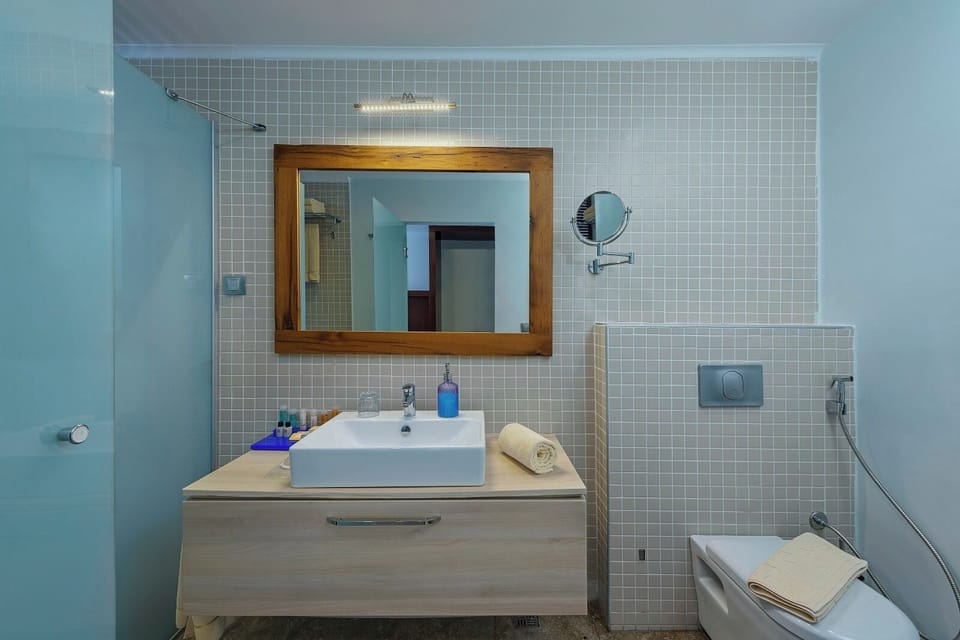 Shower, hair dryer, slippers, towels