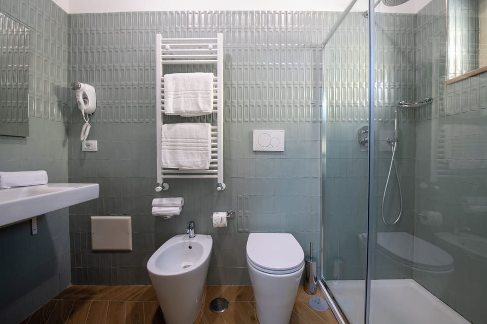 Bathroom | Hair dryer, bidet, towels, soap