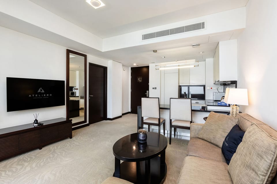Premium Apartment, 1 Bedroom, Balcony, Canal View | Living room | 100-cm Smart TV with digital channels