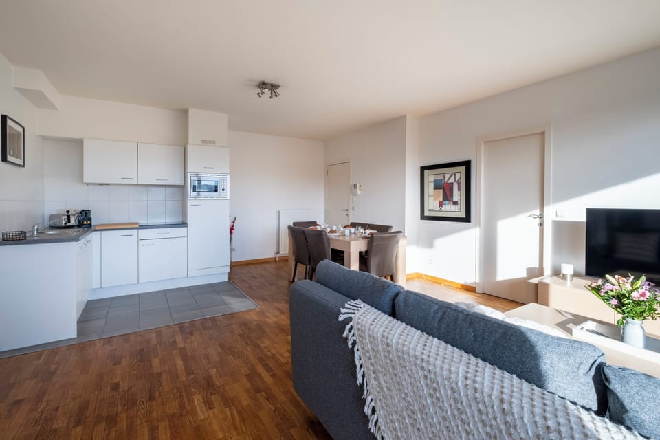 Apartment, City View | Living area | Flat-screen TV