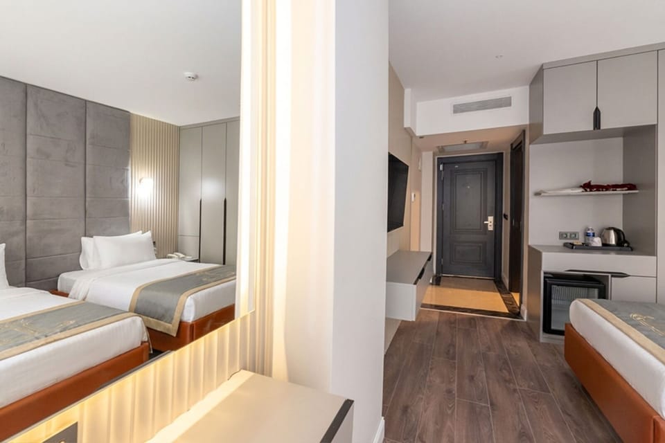 Family Room | Premium bedding, in-room safe, WiFi (free), bed sheets