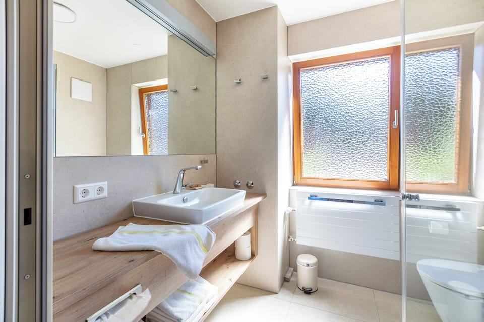 Deluxe Condo, Balcony, River View | Bathroom | Shower, free toiletries, hair dryer, towels