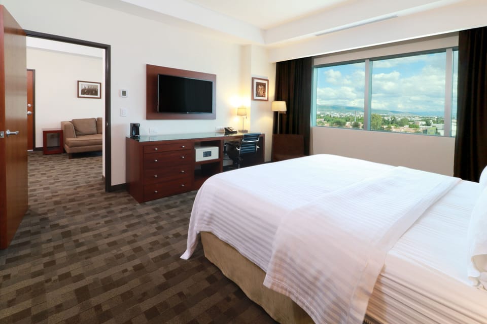 Suite, 1 Bedroom | In-room safe, desk, laptop workspace, iron/ironing board