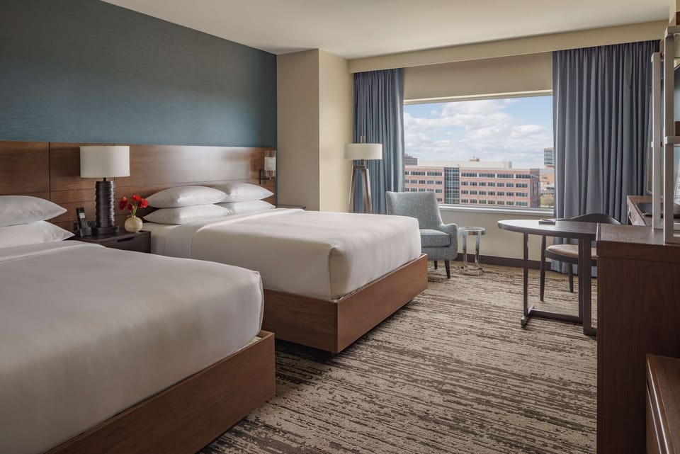 Room, 2 Queen Beds | Hypo-allergenic bedding available, pillowtop beds, in-room safe, desk