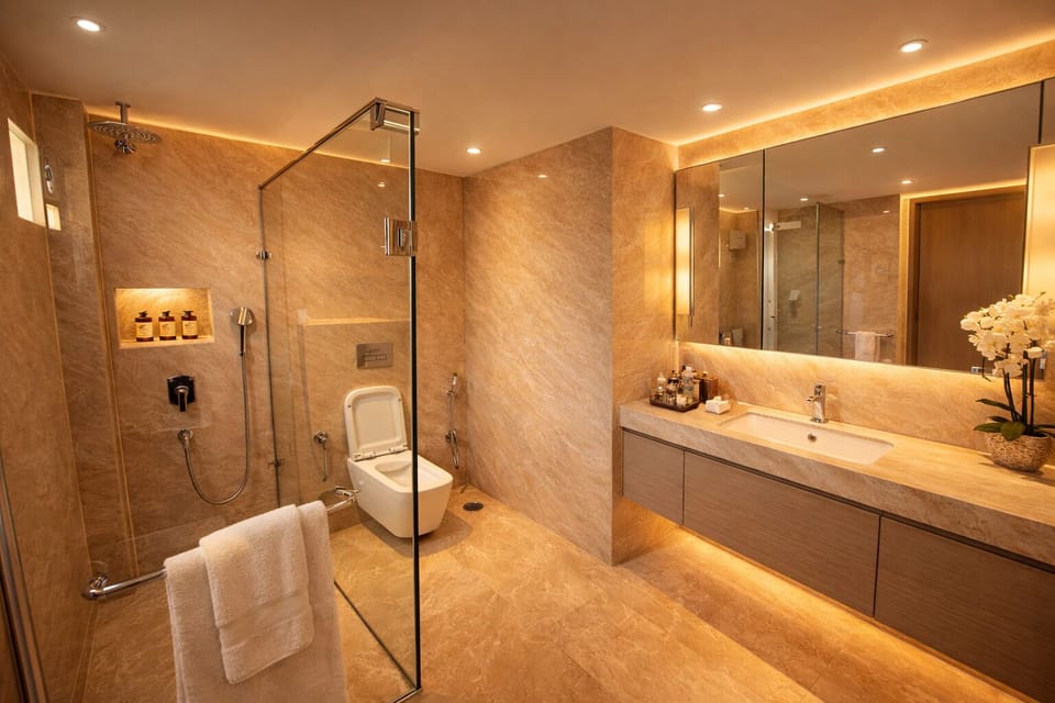 Deluxe Double Room | Bathroom | Hydromassage showerhead, designer toiletries, hair dryer, slippers