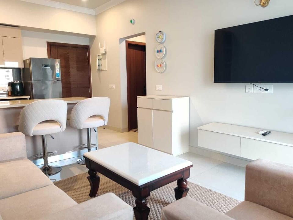 Luxury Apartment | Living area | 32-inch flat-screen TV with cable channels
