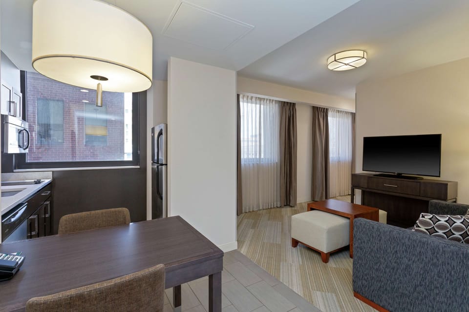 Suite, 1 King Bed, Non Smoking, Corner | Living area | 27-inch flat-screen TV with cable channels, TV, pay movies