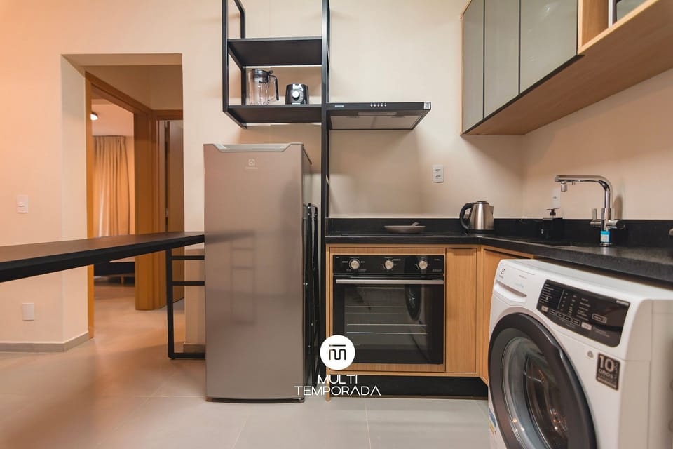 Premium Apartment, Pool Access | Private kitchen | Fridge, microwave, cookware/dishes/utensils, dining tables
