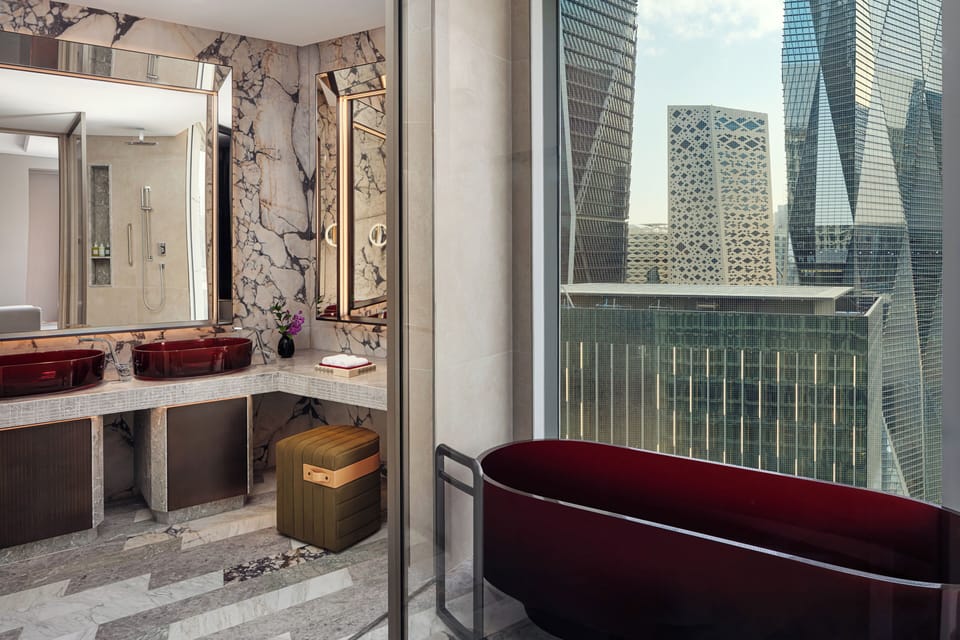 Suite, 1 King Bed, City View (View) | Bathroom | Separate tub and shower, hair dryer, bathrobes, slippers