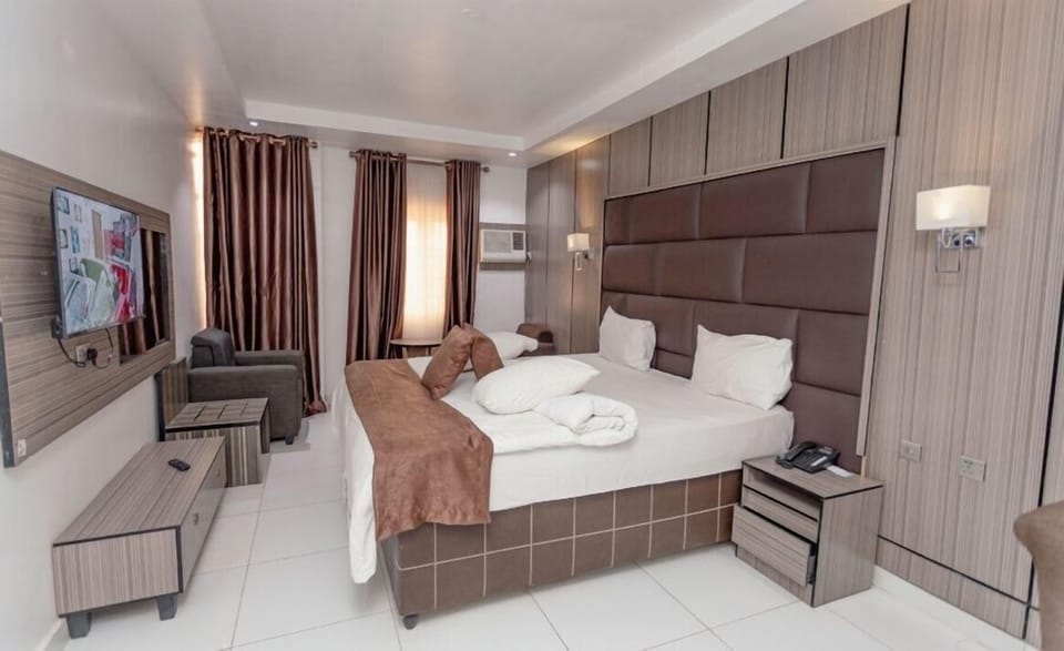 Family Room, Balcony, City View | Desk, laptop workspace, blackout drapes, soundproofing