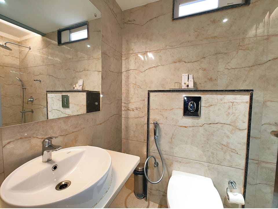 Shower, rainfall showerhead, slippers, towels