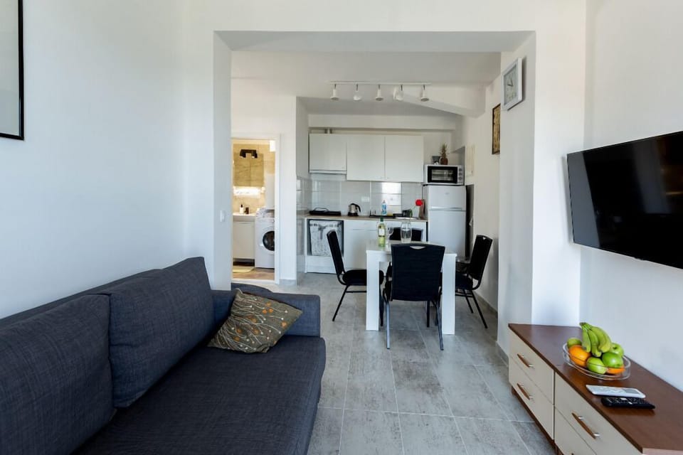 Apartment, Balcony, Sea View | Living area | Flat-screen TV