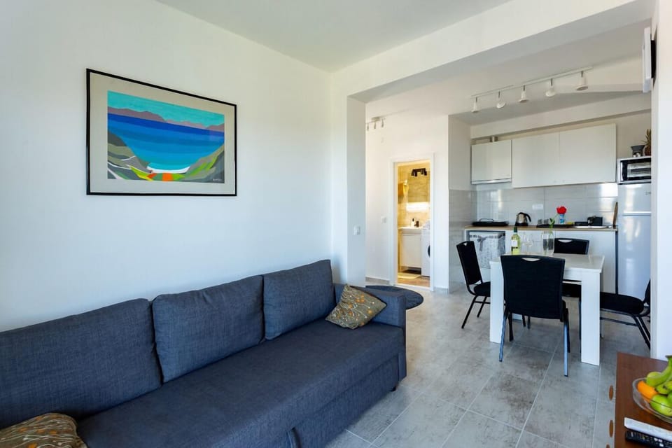 Apartment, Balcony, Sea View | Living area | Flat-screen TV