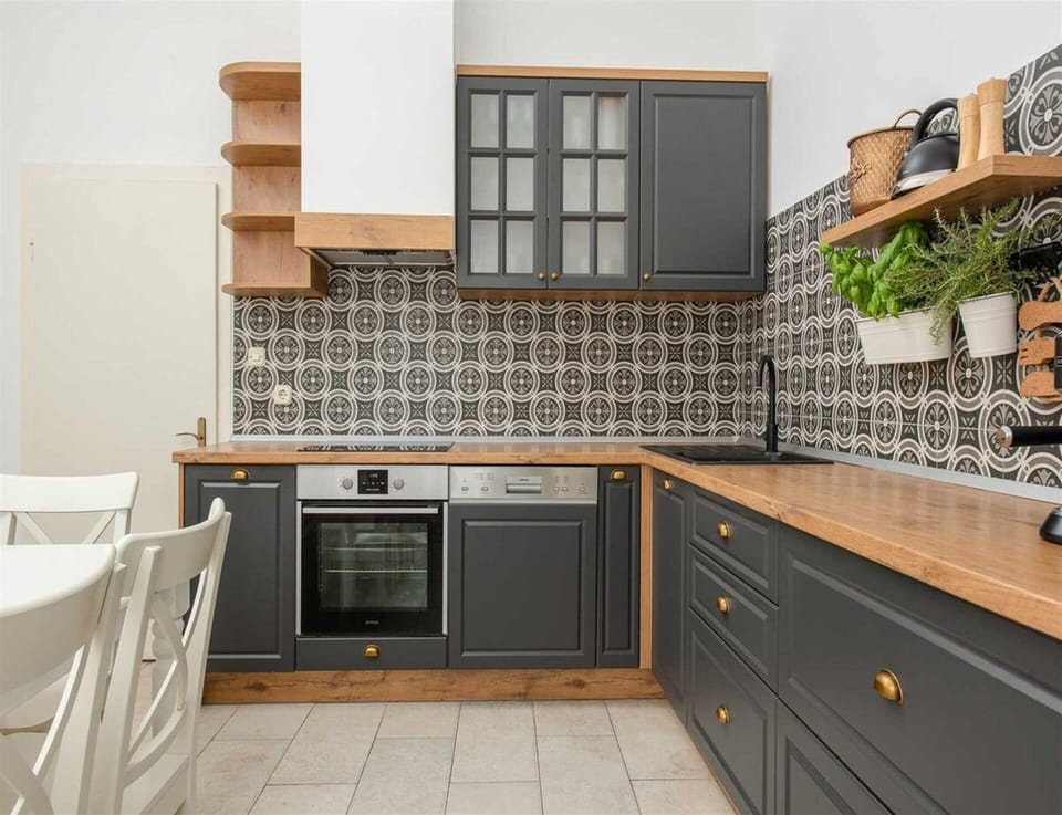 Villa | Private kitchen | Highchair, cleaning supplies