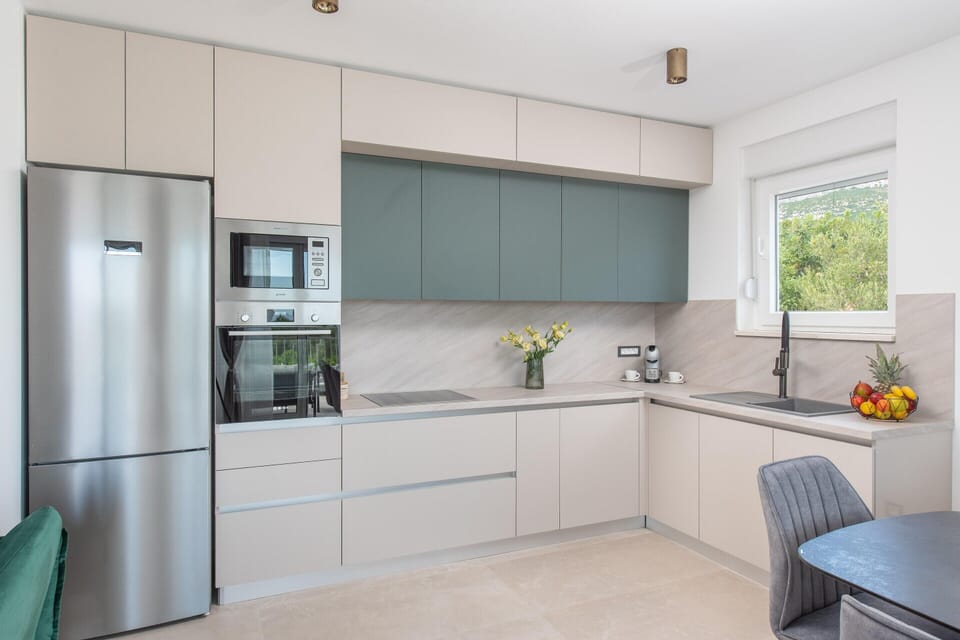 Villa | Private kitchen | Highchair, cleaning supplies