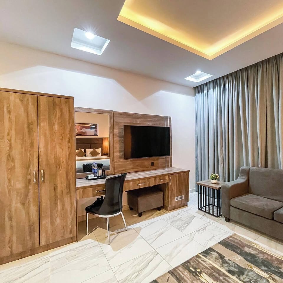 Deluxe Apartment, Balcony, City View | Living area | Flat-screen TV