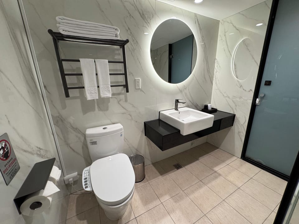Twin Room | Bathroom | Rainfall showerhead, hair dryer, slippers, electronic bidet