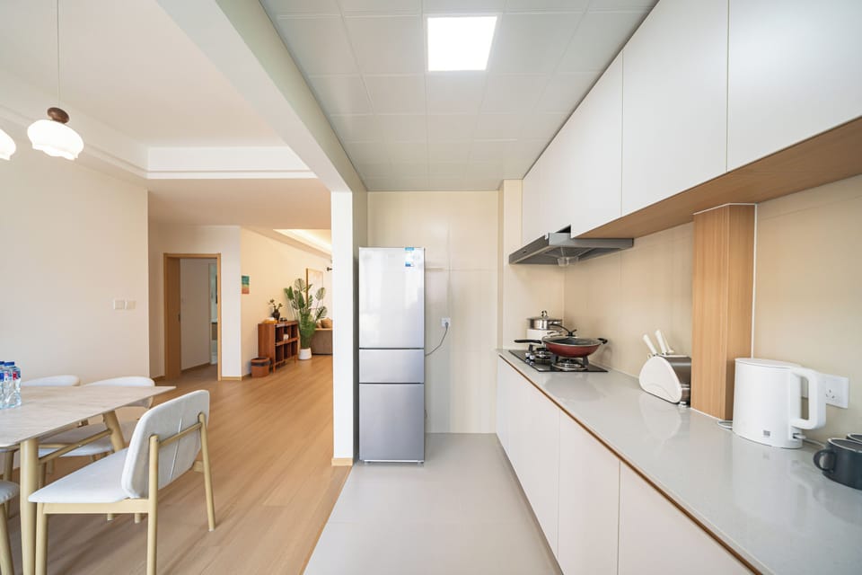 Apartment | Private kitchen | Full-size fridge, stovetop, cookware/dishes/utensils, cleaning supplies