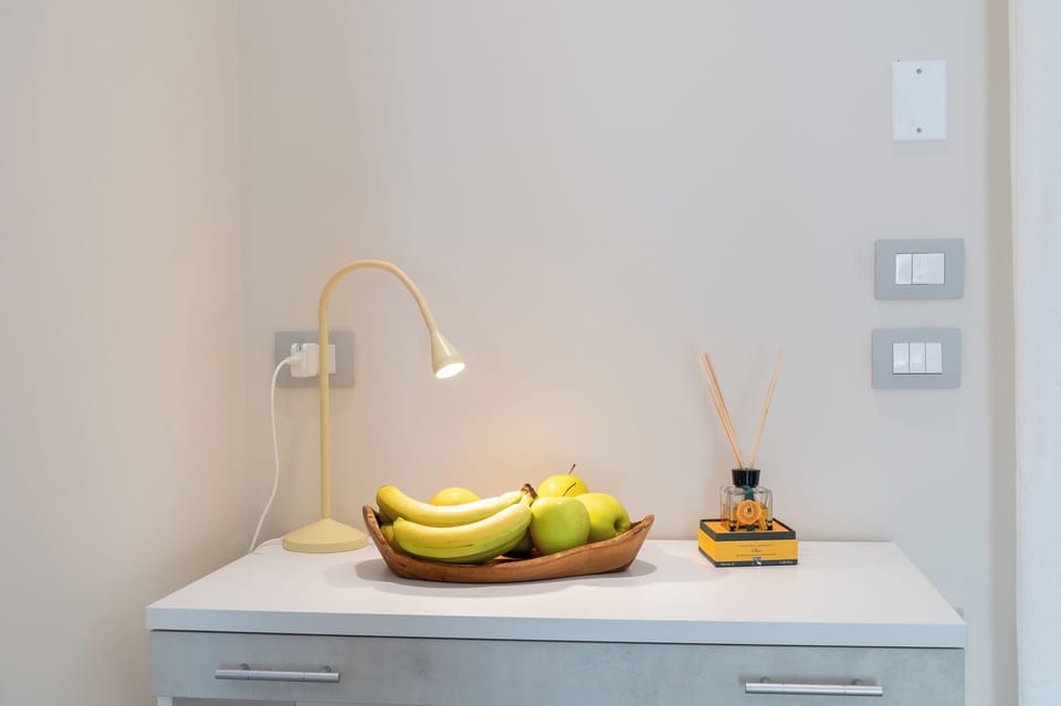 Deluxe Room, 1 Bedroom, Patio, Pool View | Minibar, in-room safe, desk, laptop workspace